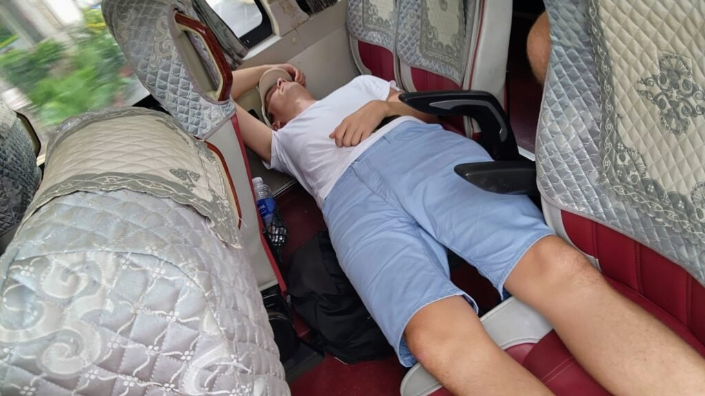Scott asleep on the bus
